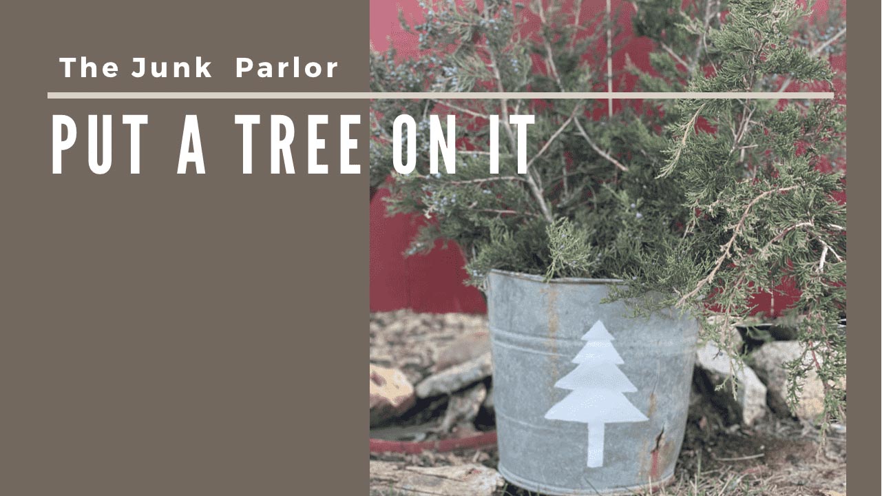 Blog Header with text saying "the junk parlor and a title of "Put a Tree on it" with an image of the DIY Christmas Tree Bucket