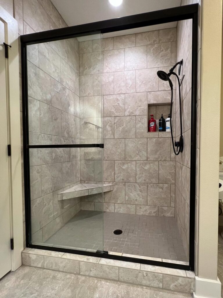 Master bathroom shower. Tiled with glass door. The Junk Parlor.