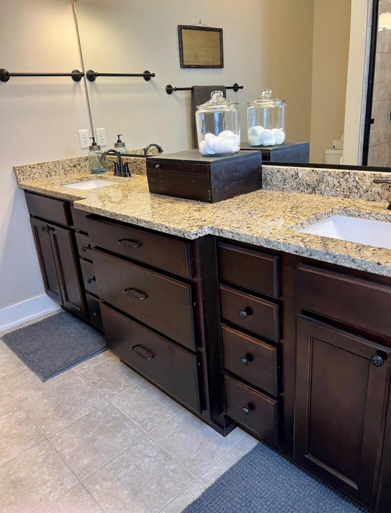 Master bathroom double vanity with a view of the extra tall cabinets. The Junk Parlor