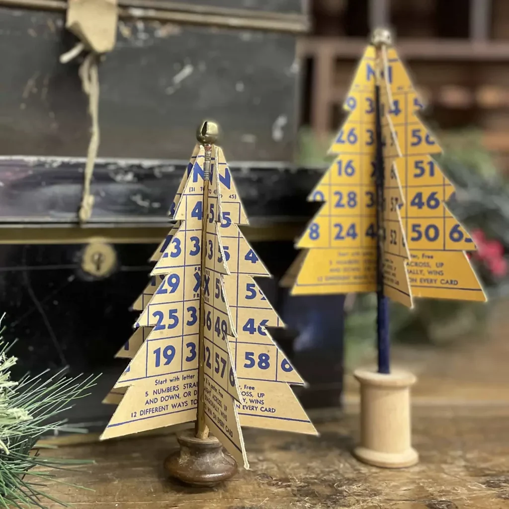 Finished Christmas trees made from cut bingo cards.