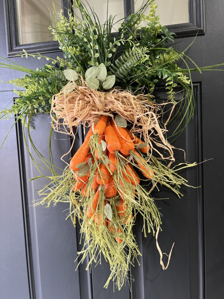 Carrot door hanger, hanging on my black door.