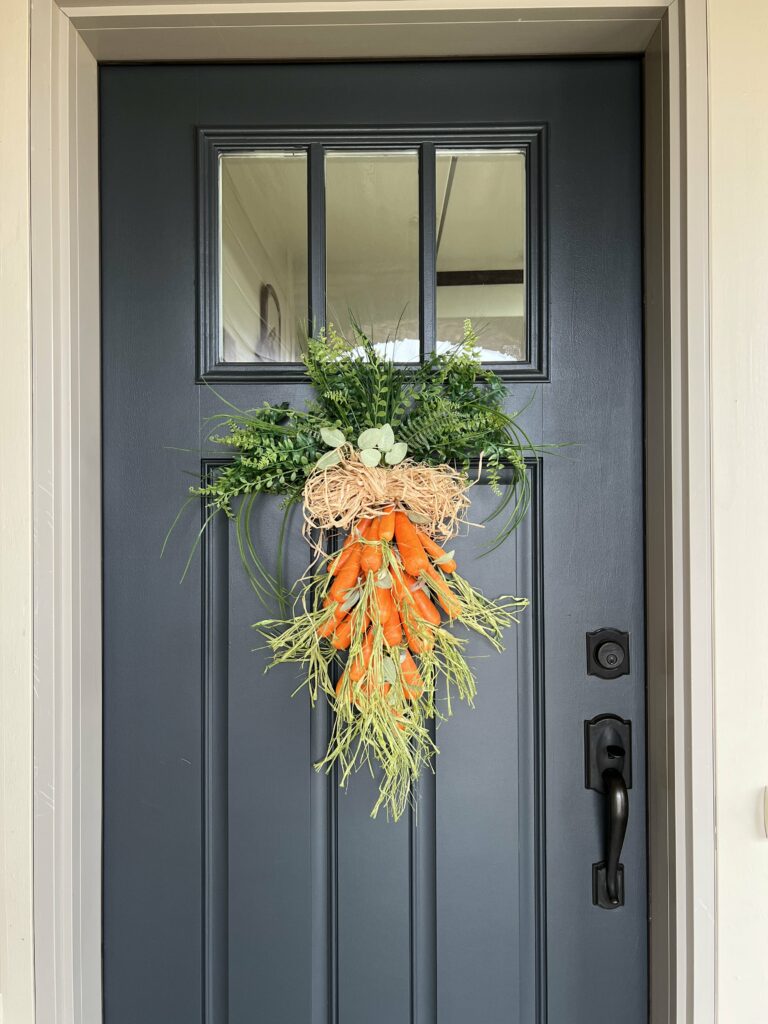 DIY carrot door hanger hanging on the door.