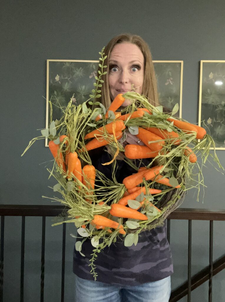 Brooke Johnson | The Junk Parlor holding a thrifted carrot wreath.