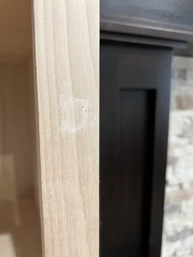 upclose view of wood filler in a nail hole