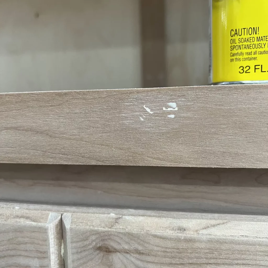 upclose view of wood filler in a nail hole