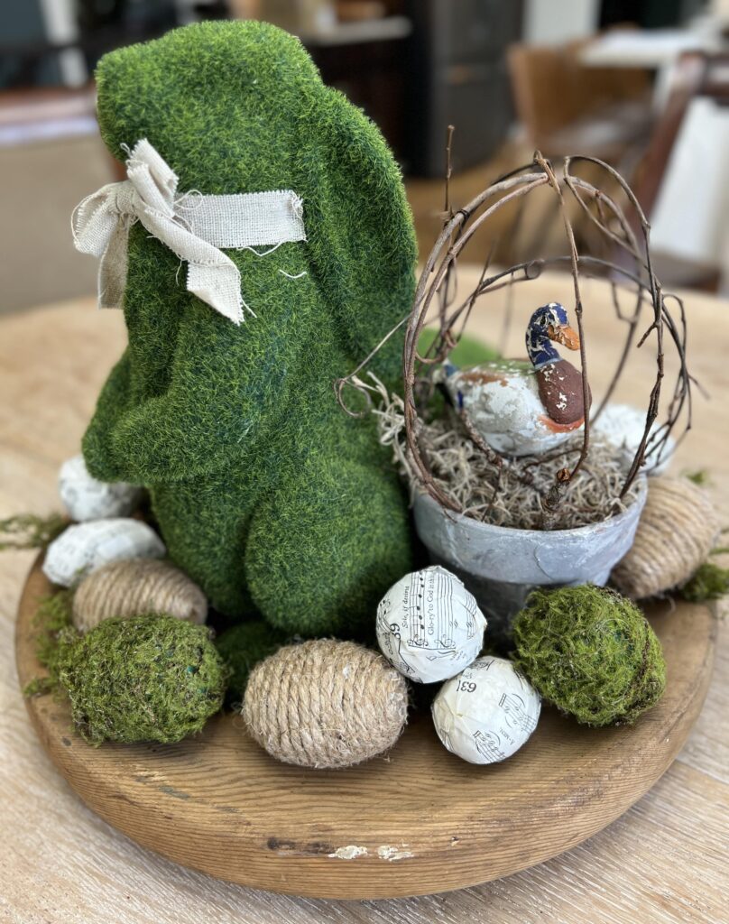 spring table centerpiece, moss covered bunnies, eggs, and a grapevine topiary