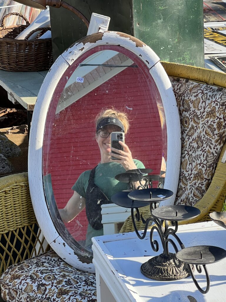 Selfie in an oval mirror at the Elkhorn flea market