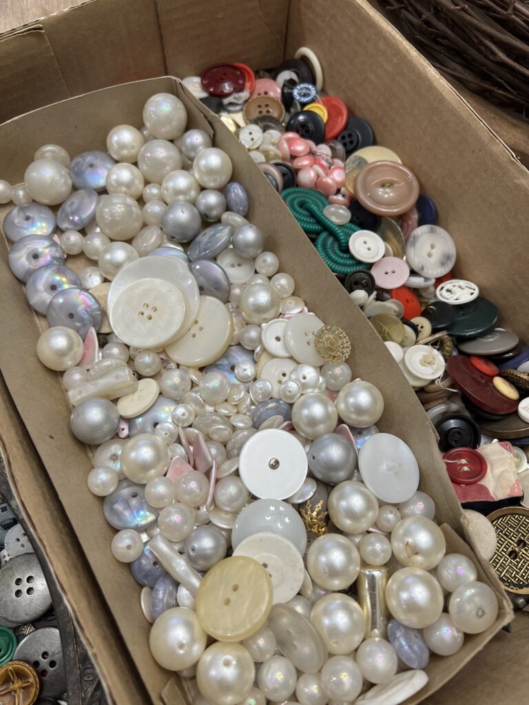 box of buttons, some sorted