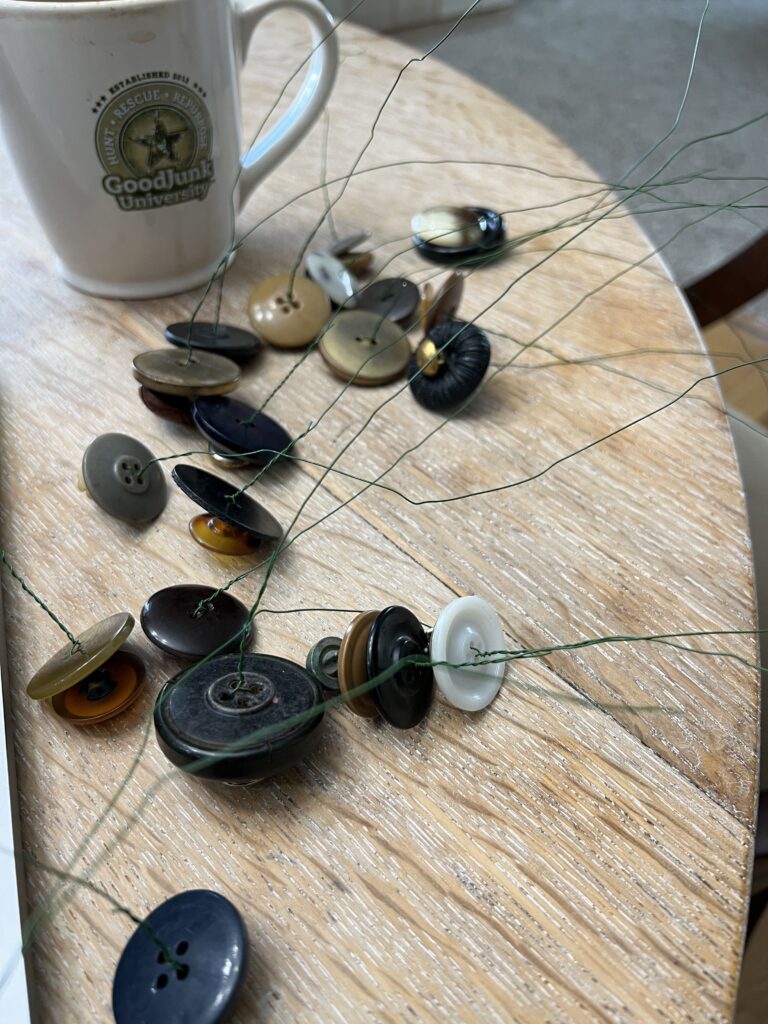 A bunch of buttons made from flowers laying on the table