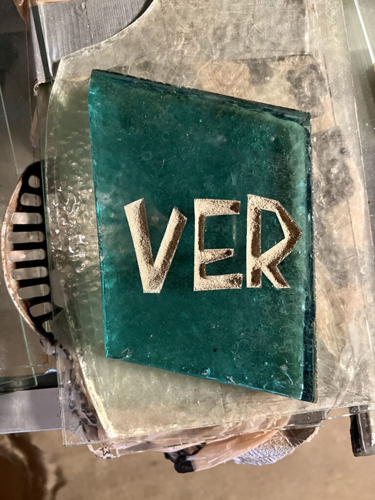 green glass that says ver