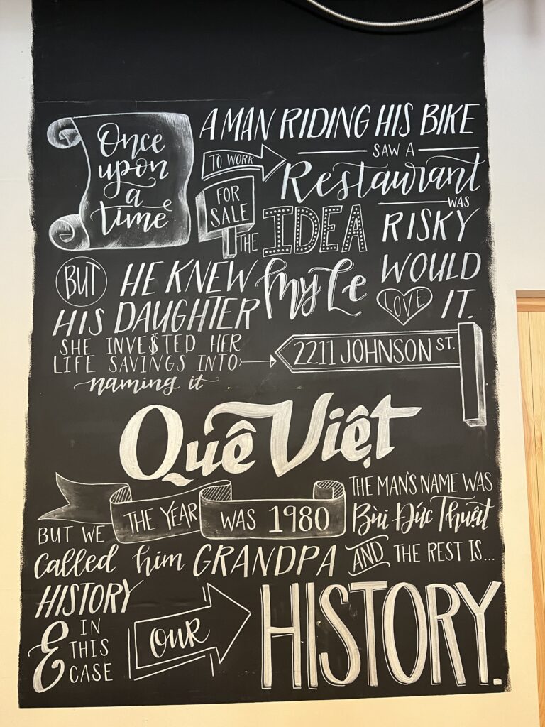 Art work/chalk board sign inside Que Viet.