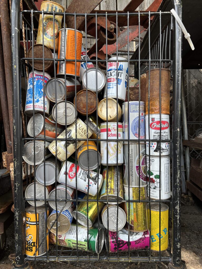 big basket cart full of old cans