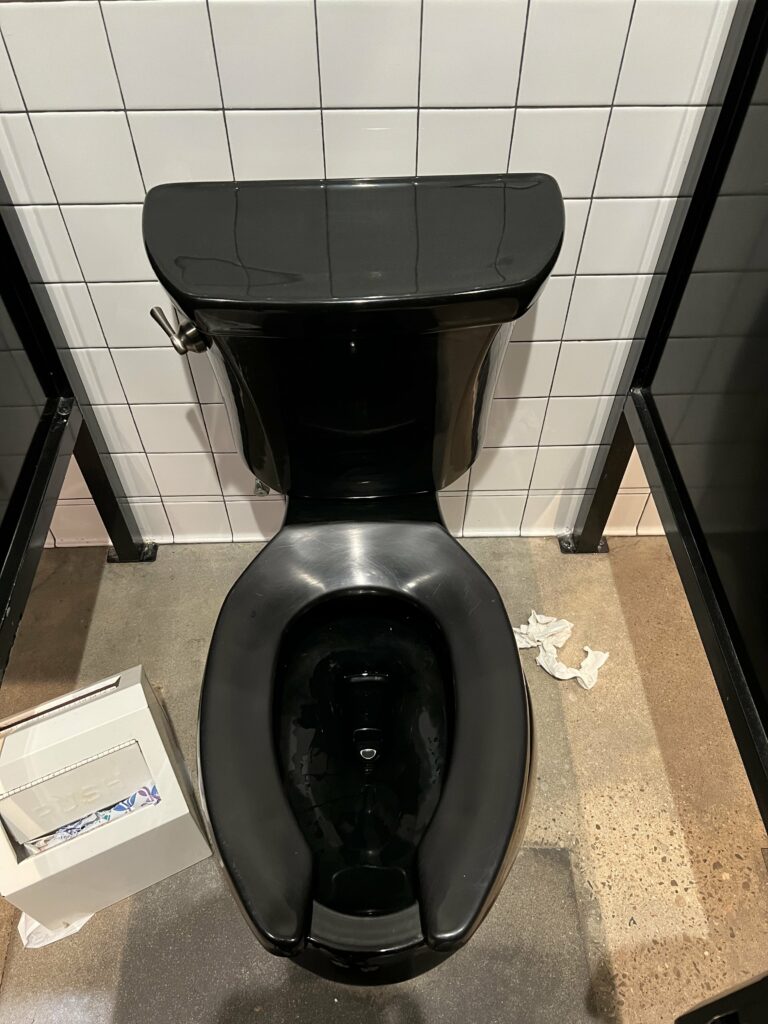 Black toilet at Torchy's Tacos