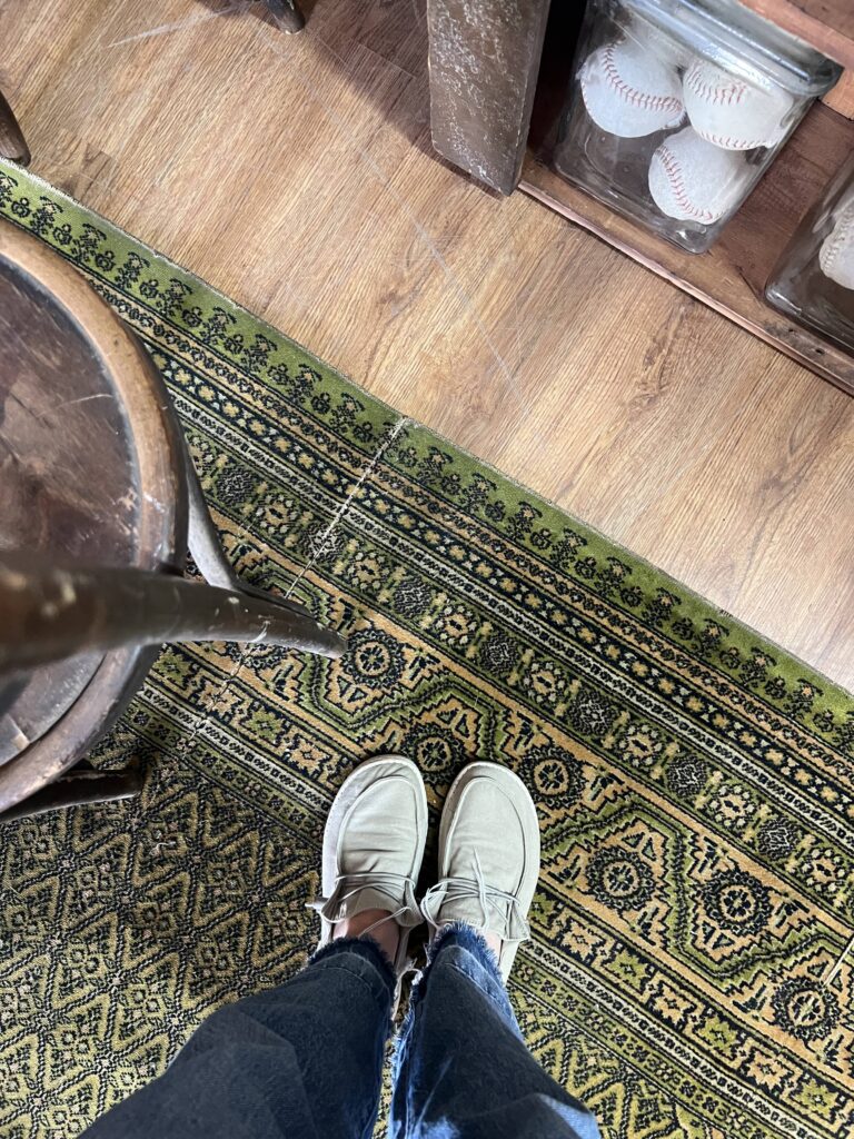 Standing on a green area rug