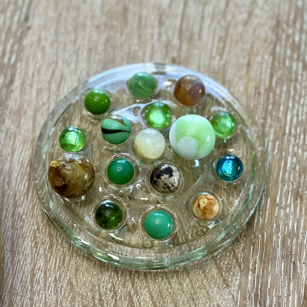 marbles on a glass flower frog