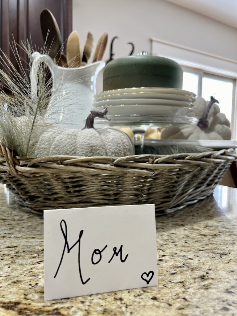 name card with mom on it in front of a basket of ironstone and pumpkins