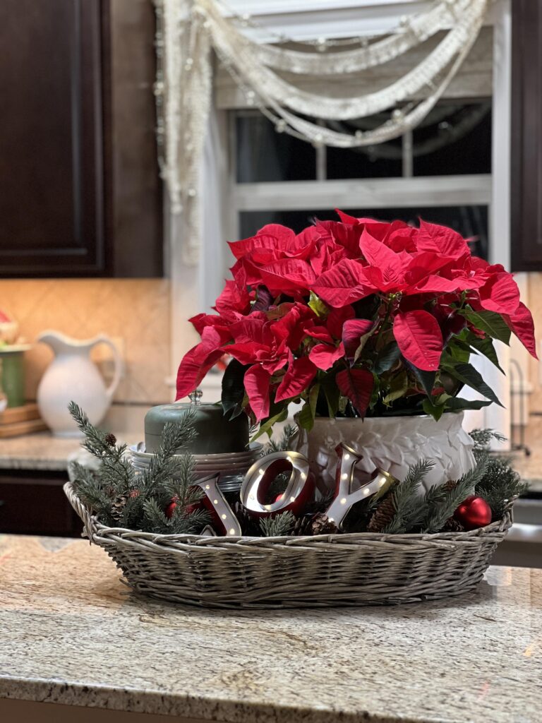 my kitchen island with a basket and red poinsettia