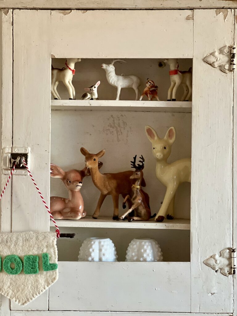 little cabinet filed with deer