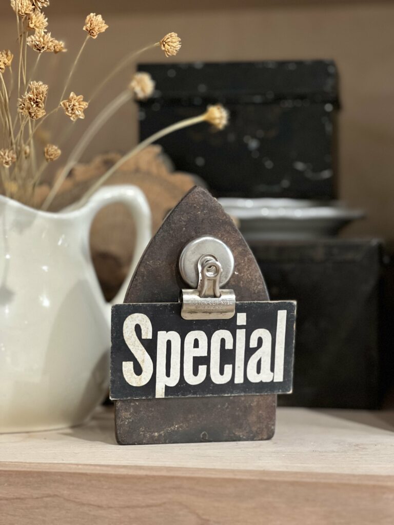 "special" card magneted to an old sad iron