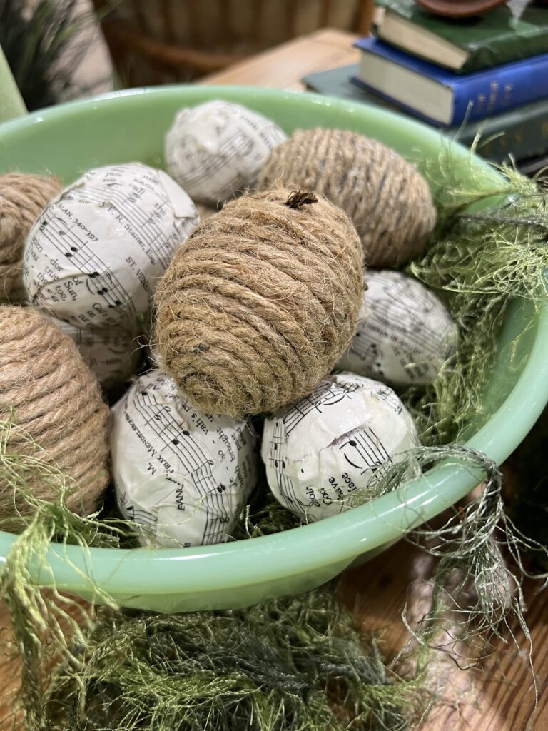 Bowl of twine and decoupaged eggs