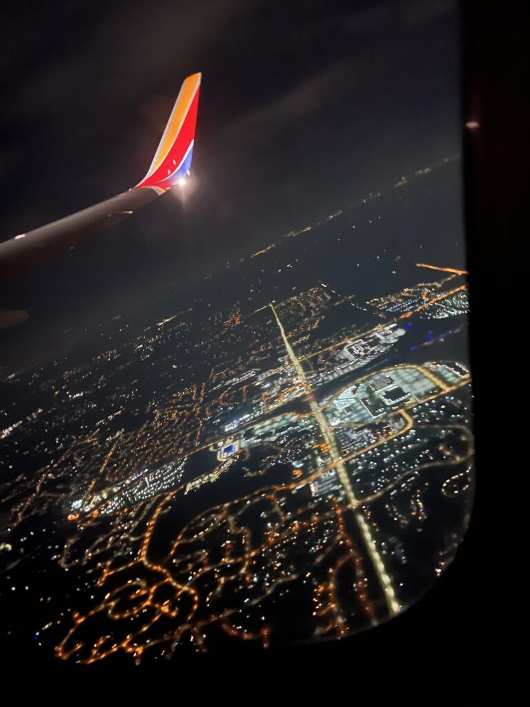 Plane window view at night