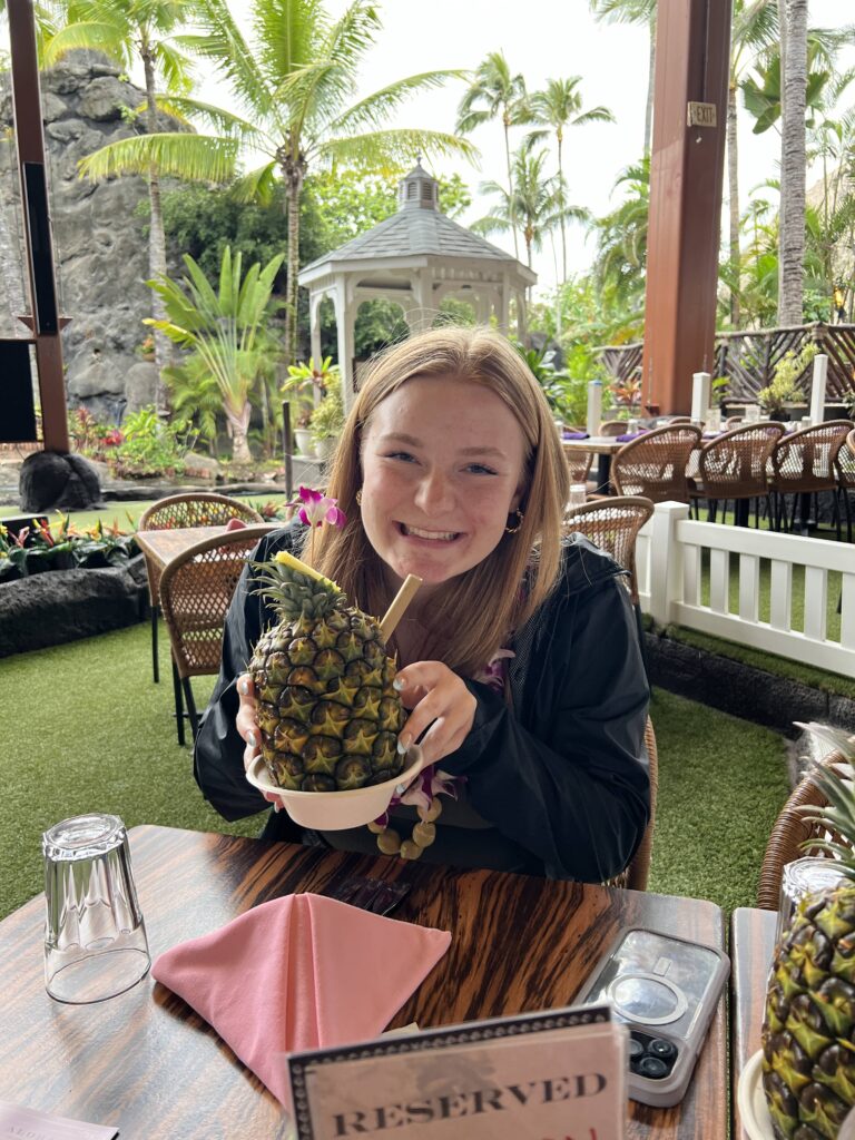 Kyler with her pineapple drink at the Luau