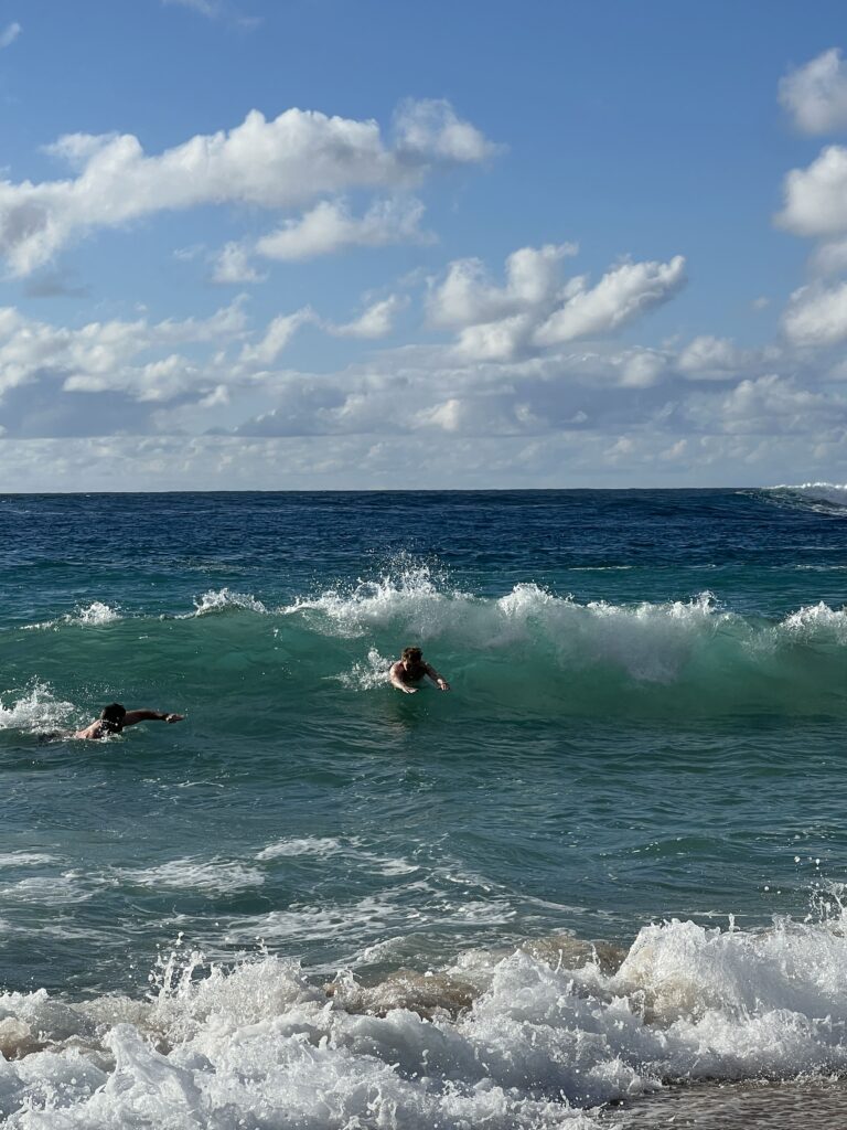 Hubby & our youngest attempting to body surf at Waimea beach