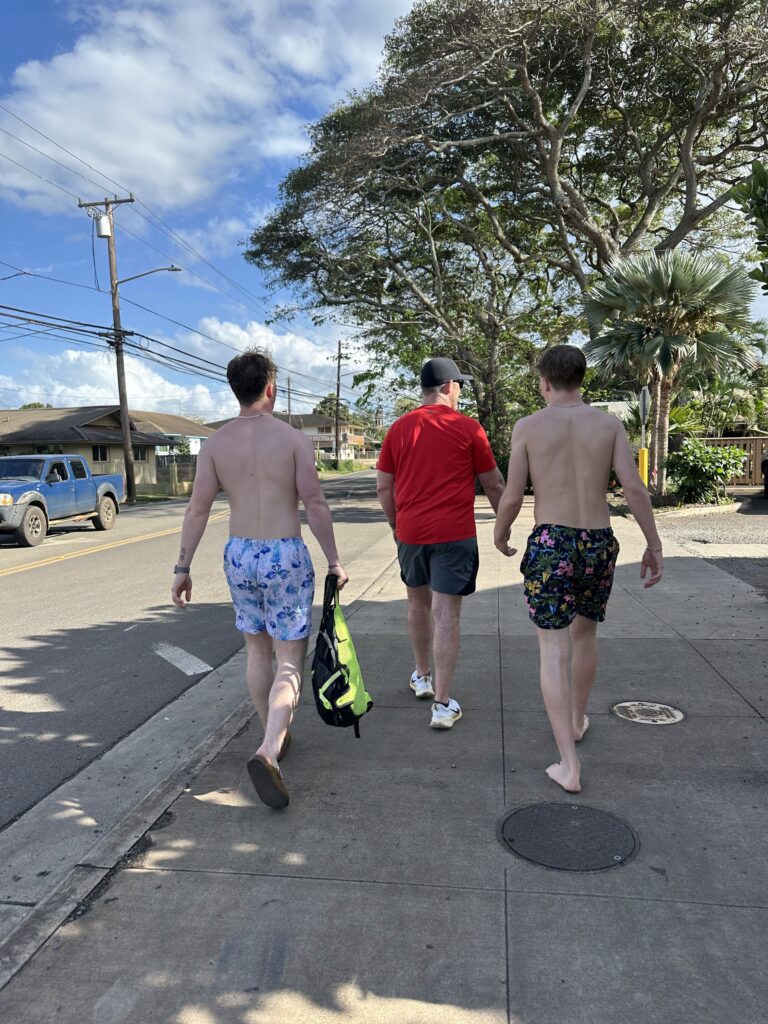 Boys walking down the street in Haleiwa