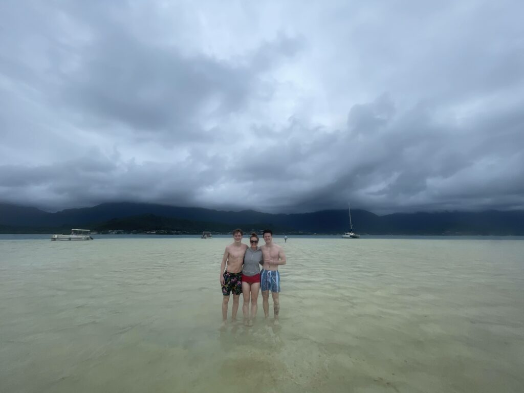 Me and the boys on the Kaneohe Sandbar you can see the storm and clouds in the distance.