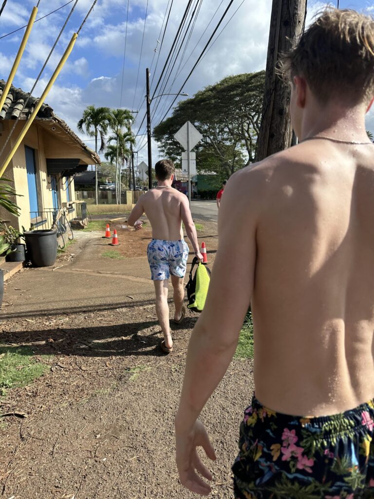 Boys walking down the street in Haleiwa